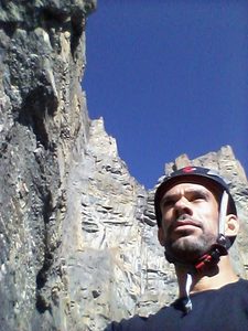 Jay, founder of Muster Point Outfitters, rock climbing in the mountains